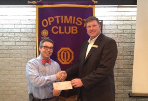 DTOC President Brian Koroknay presents a check to Neil Henry of TOPSoccer