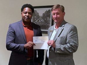 DTOC President Todd Pope (r) presents Carter Foundation Founder, James Carter (l) with DTOC's Annual Donation